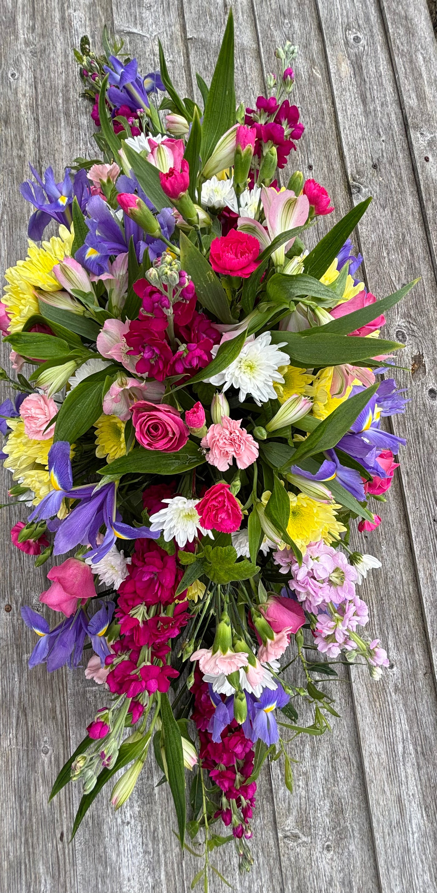 Casket double sided funeral tribute. Bright colours