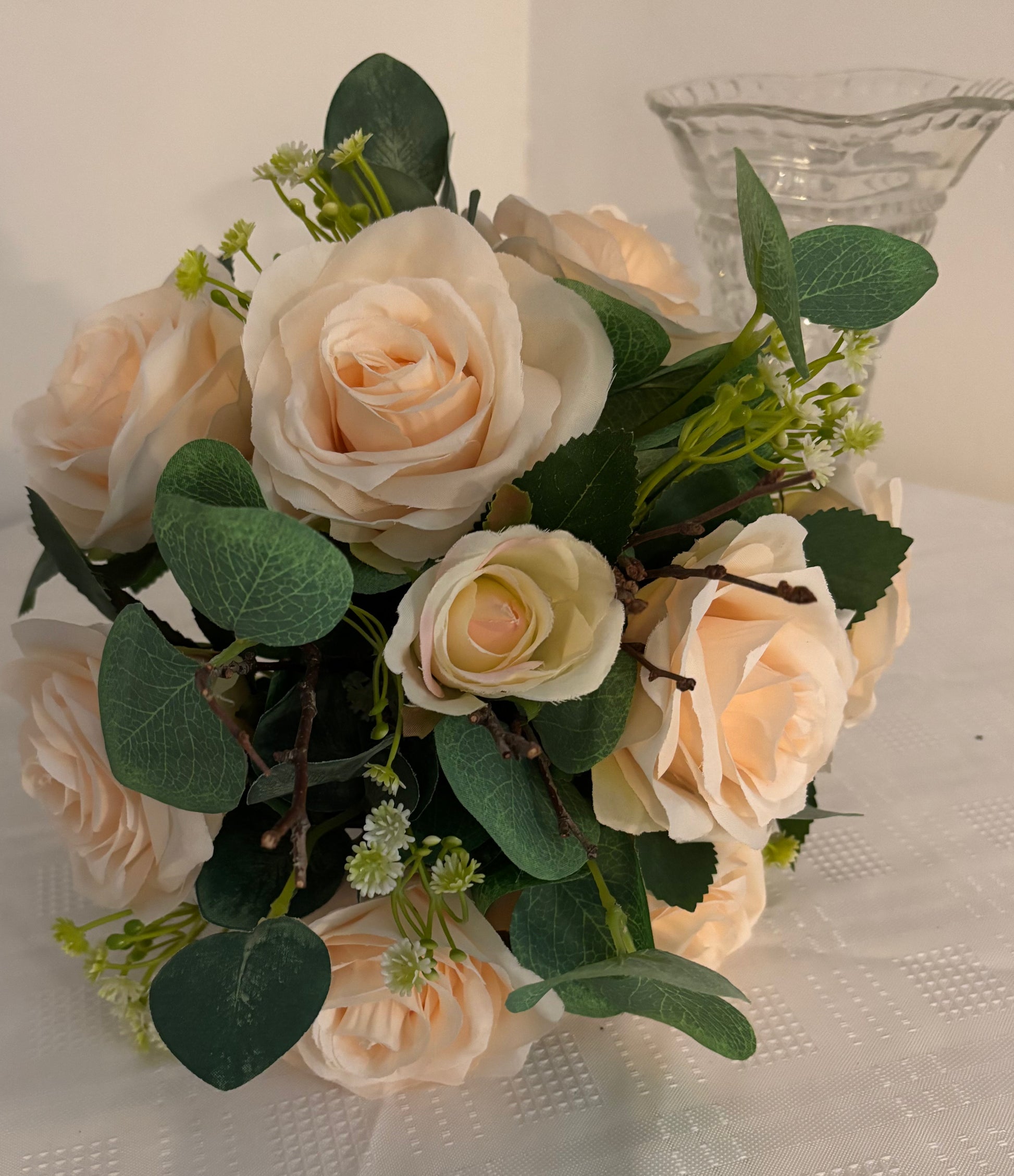 Posy bouquet of garden roses and eucalyptus
