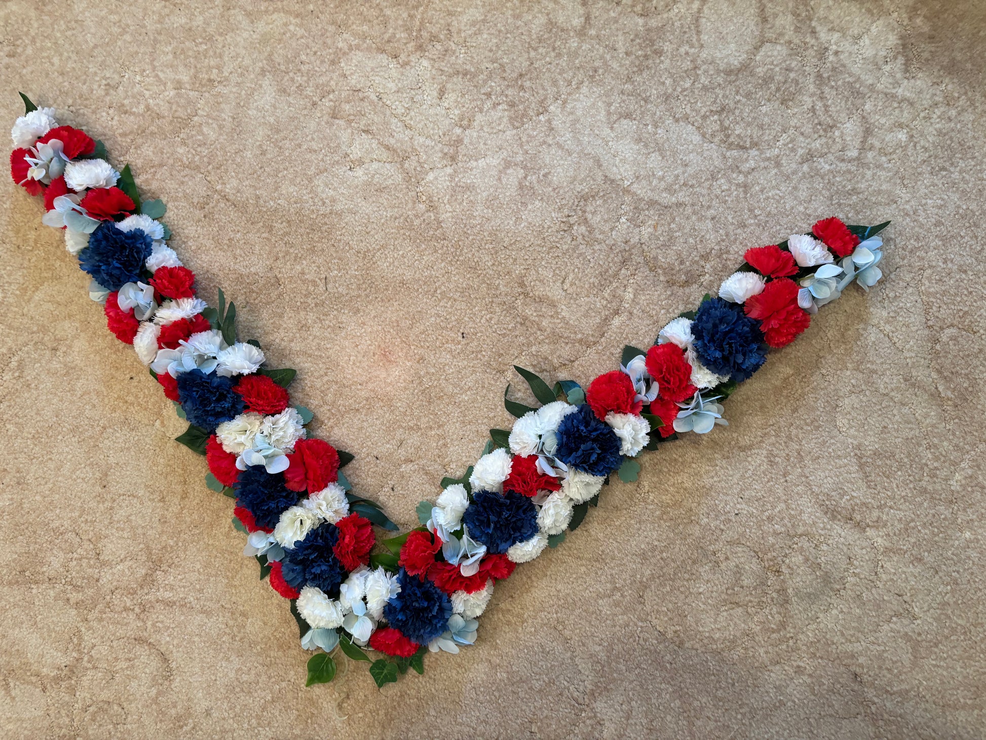 Winning pony floral neck garland in red white and blue