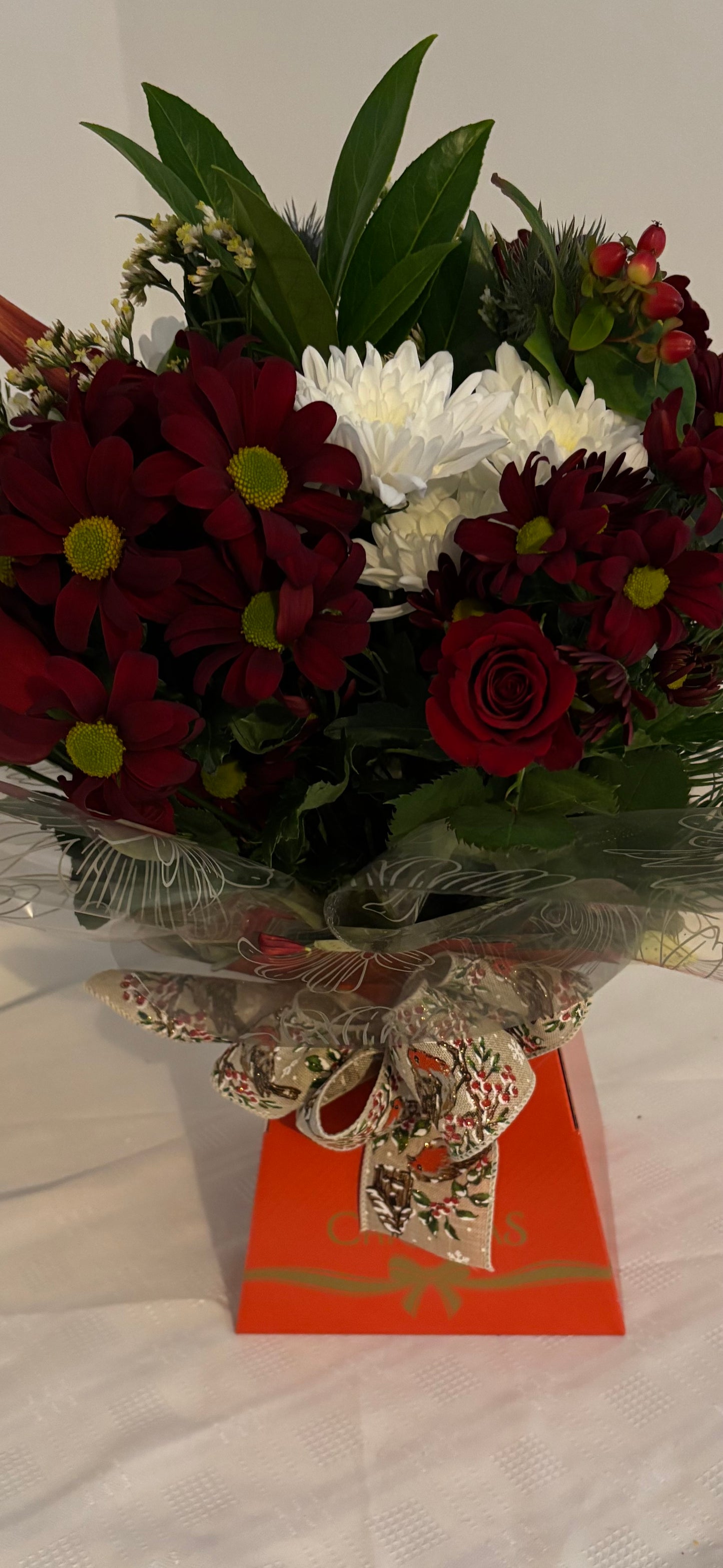 Christmas Wishes. Hand Tied Bouquet of mixed fresh flowers inspired by festive vibes.