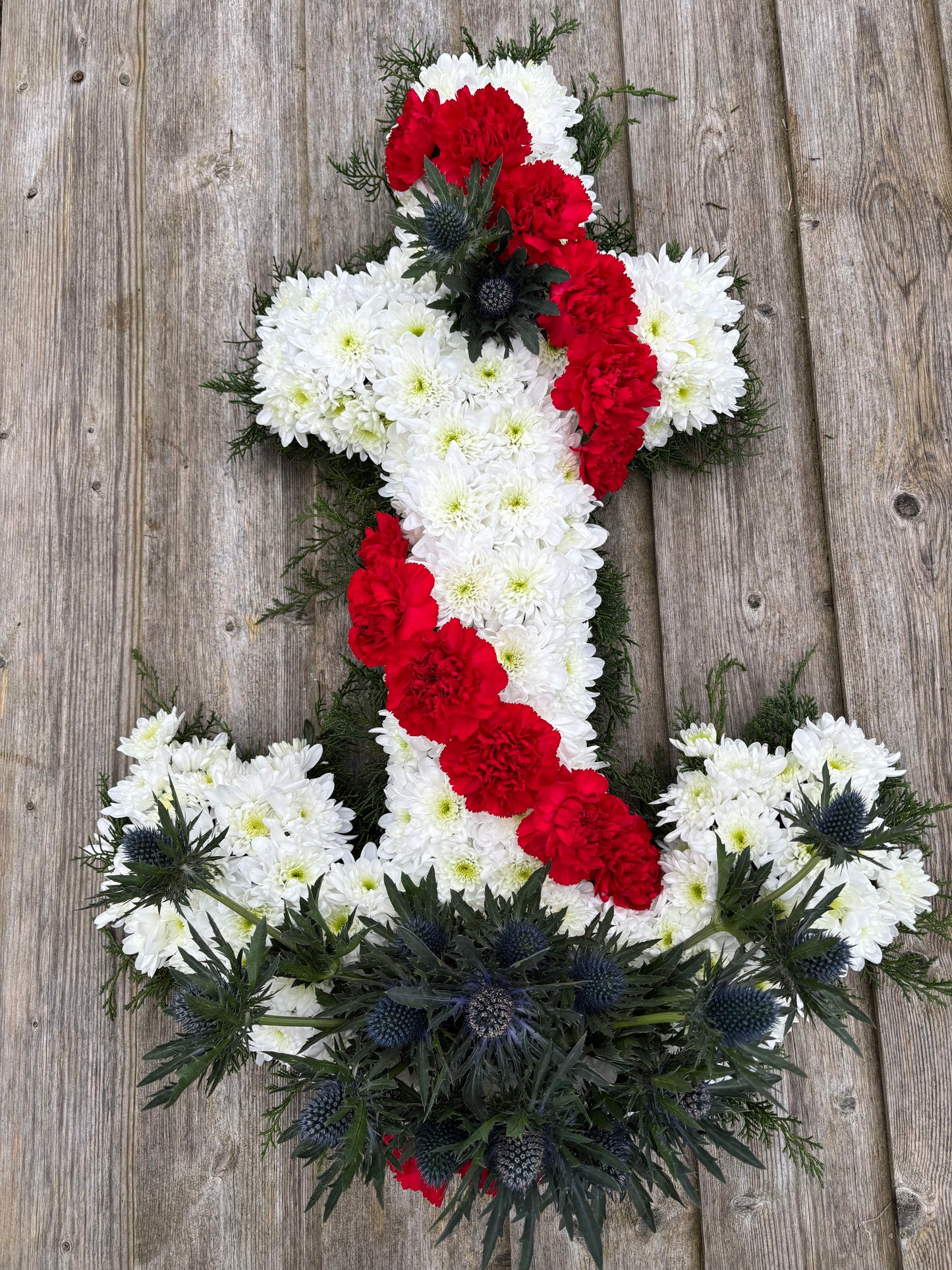 Anchor Funeral Tribute - Anchor in Red, White and Blue flowers.