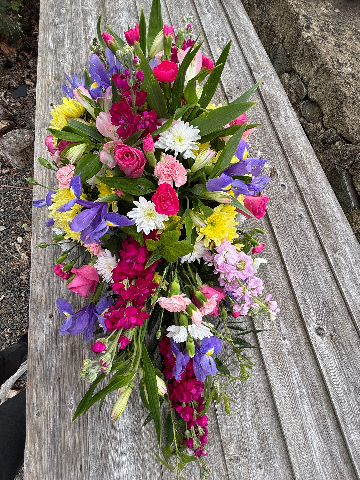 Casket double sided funeral tribute. Bright colours
