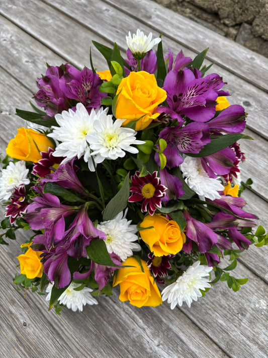 Funeral Tribute Round Posy arrangement - lilac and Yellow with a touch of white.