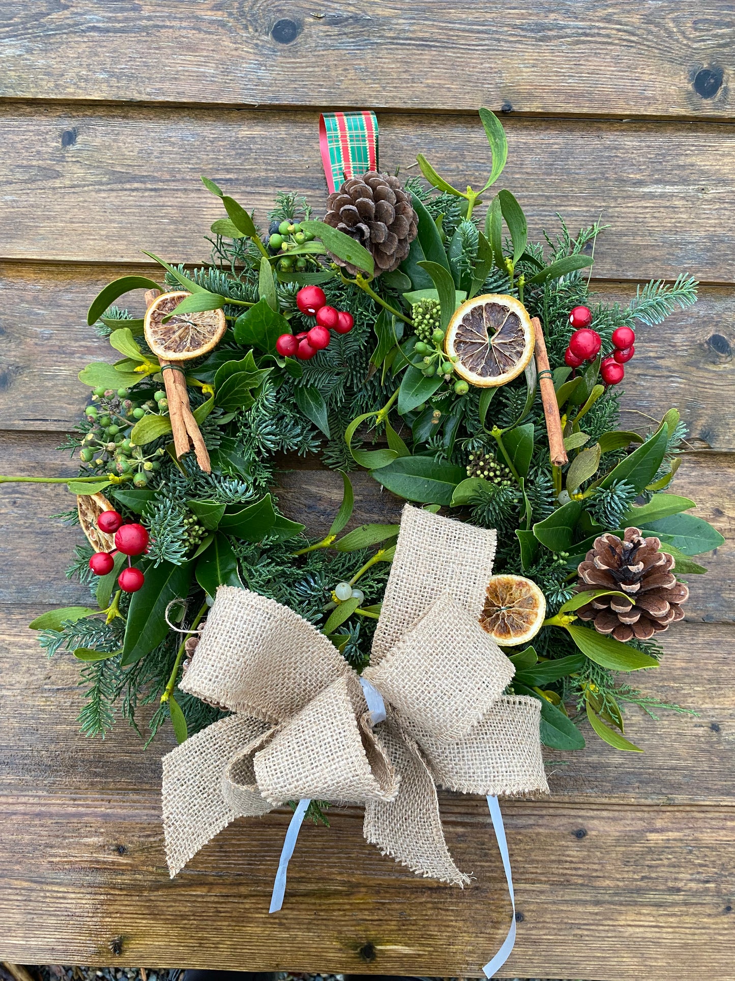 Fresh Traditional Festive Christmas hanging wreath.