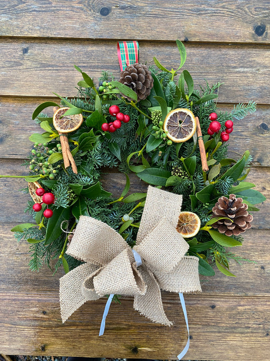 Fresh Traditional Festive Christmas hanging wreath.