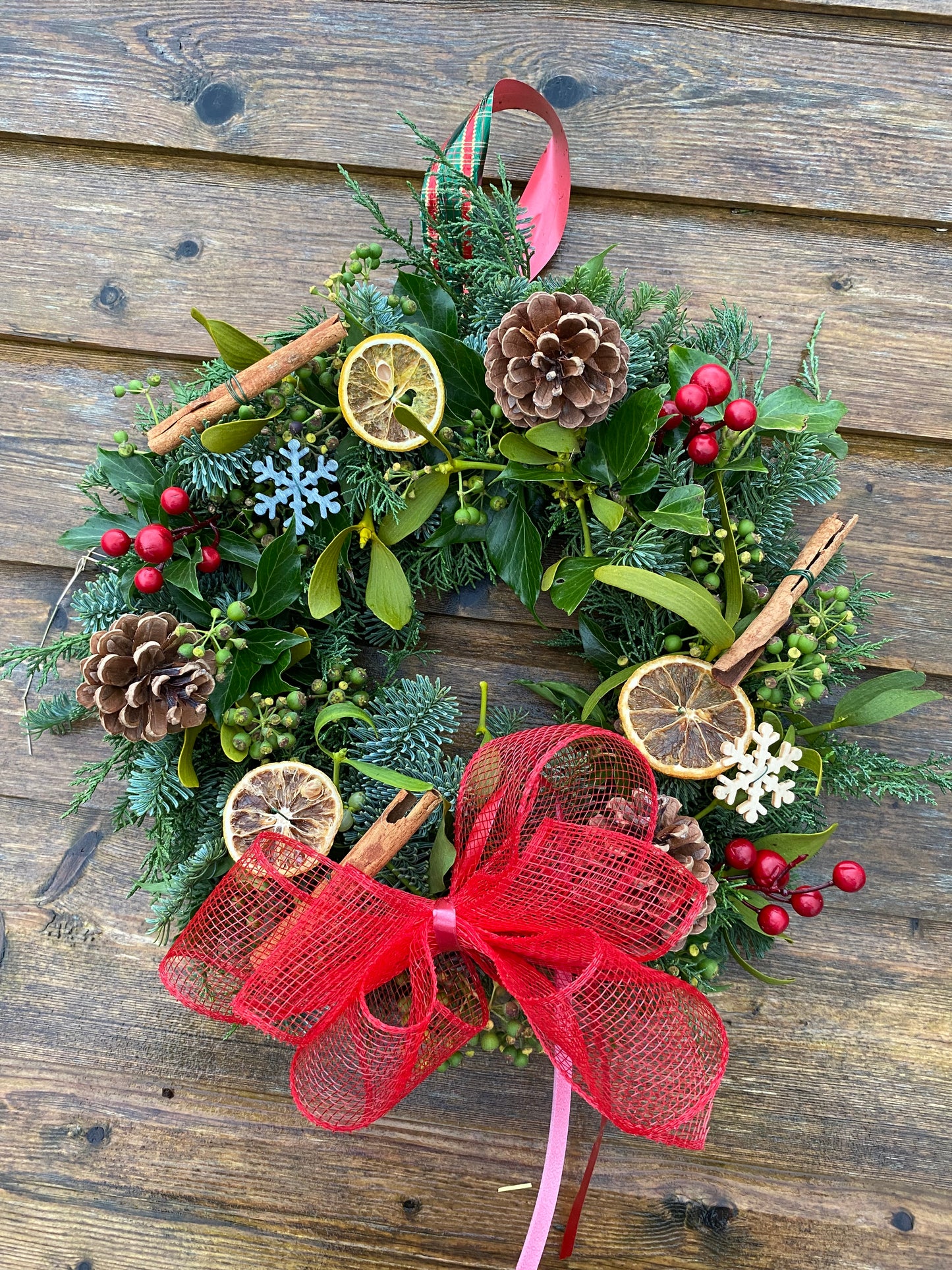 Fresh Traditional Festive Christmas hanging wreath.