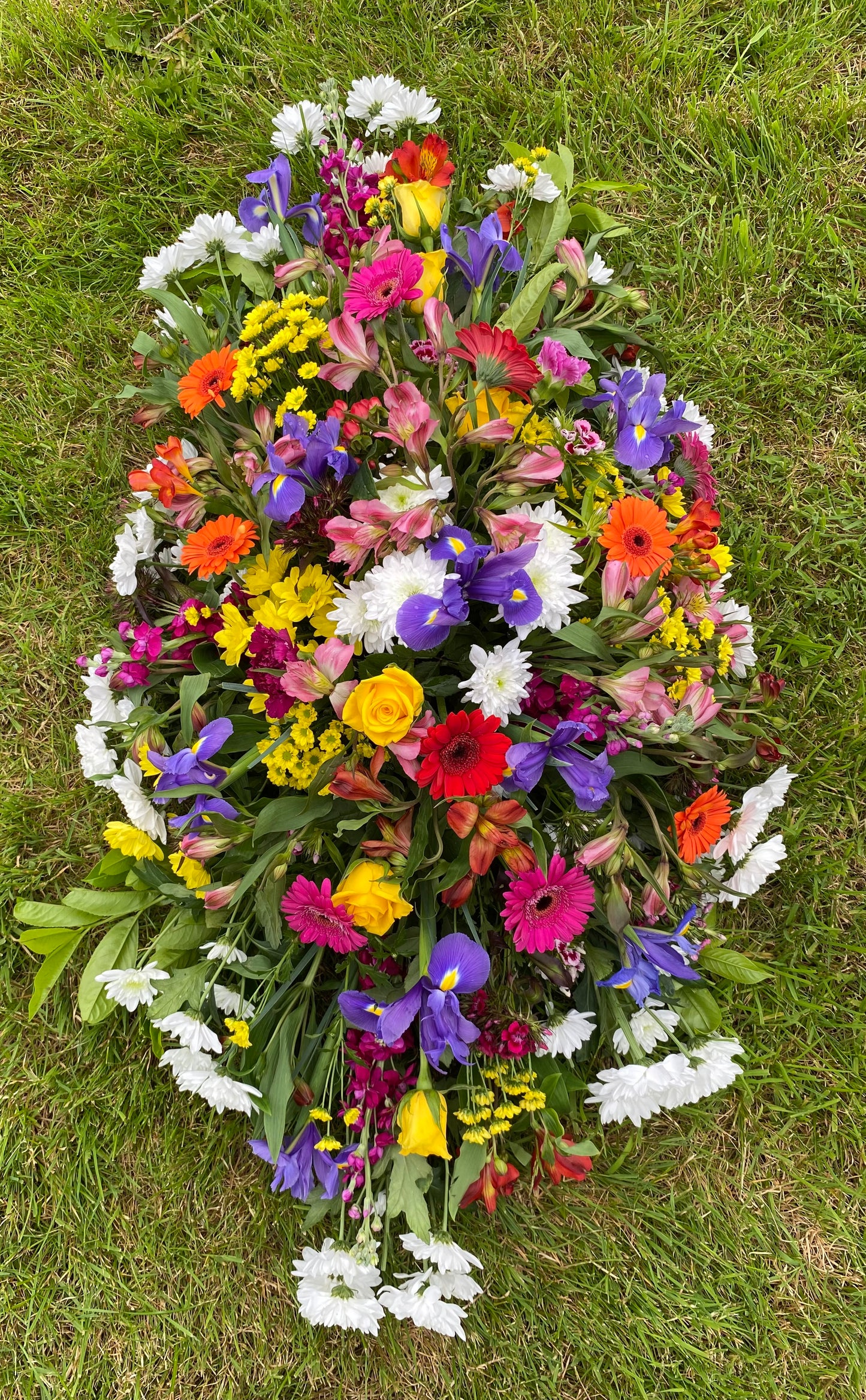 Casket double sided funeral tribute. Bright colours