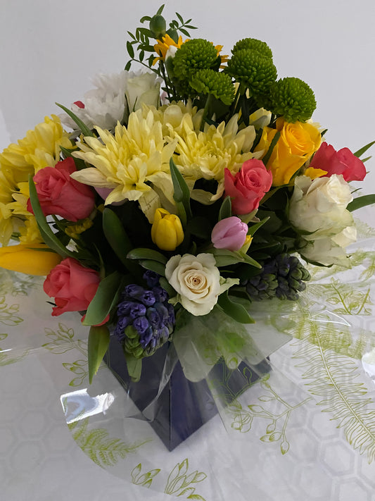Spring at the Coast.  A hand tied Bouquet of mixed fresh spring flowers.
