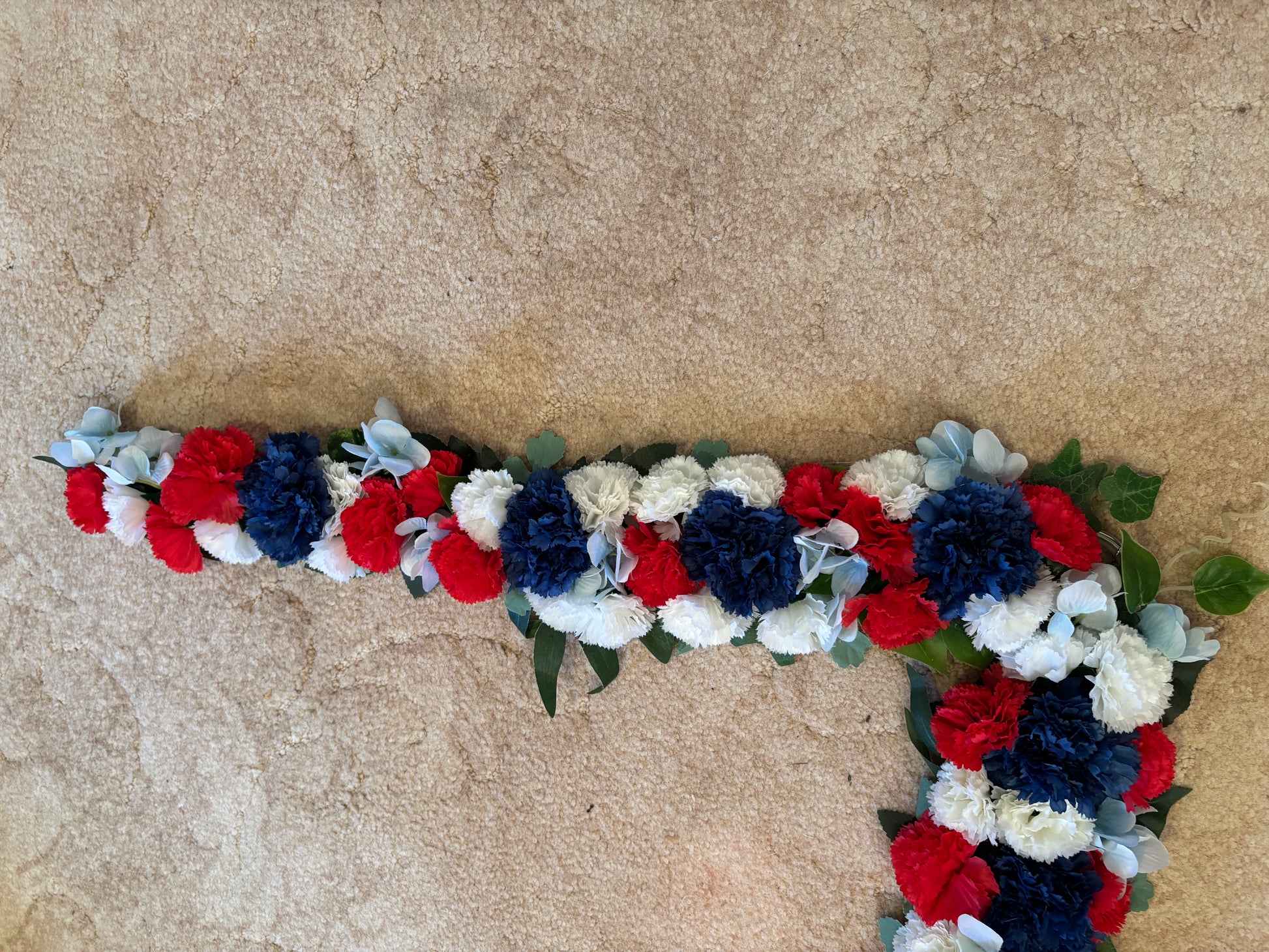 Pony floral neck garland red white and blue Solva Flowers