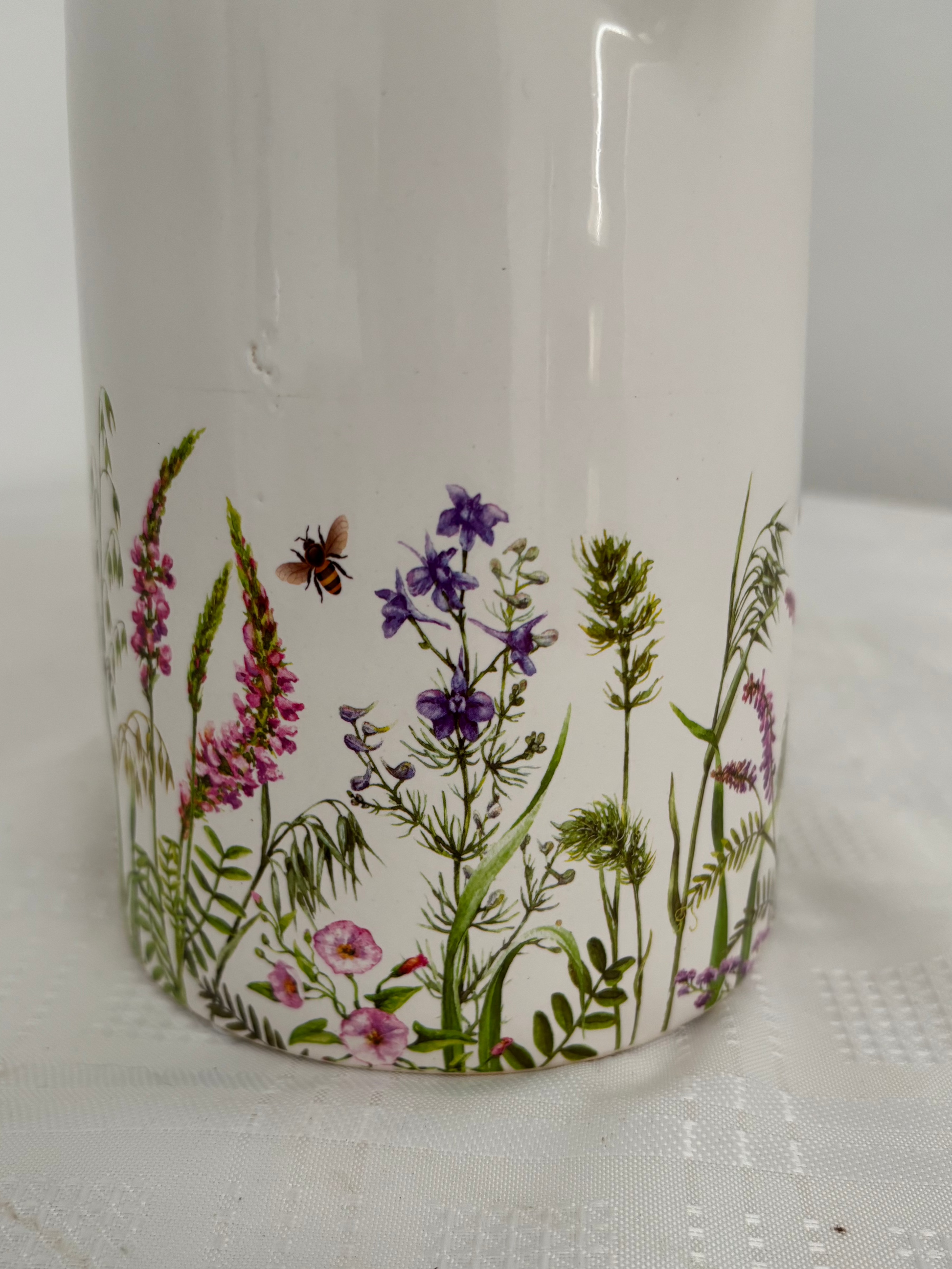 Pretty flower and bee design on white ceramic jug