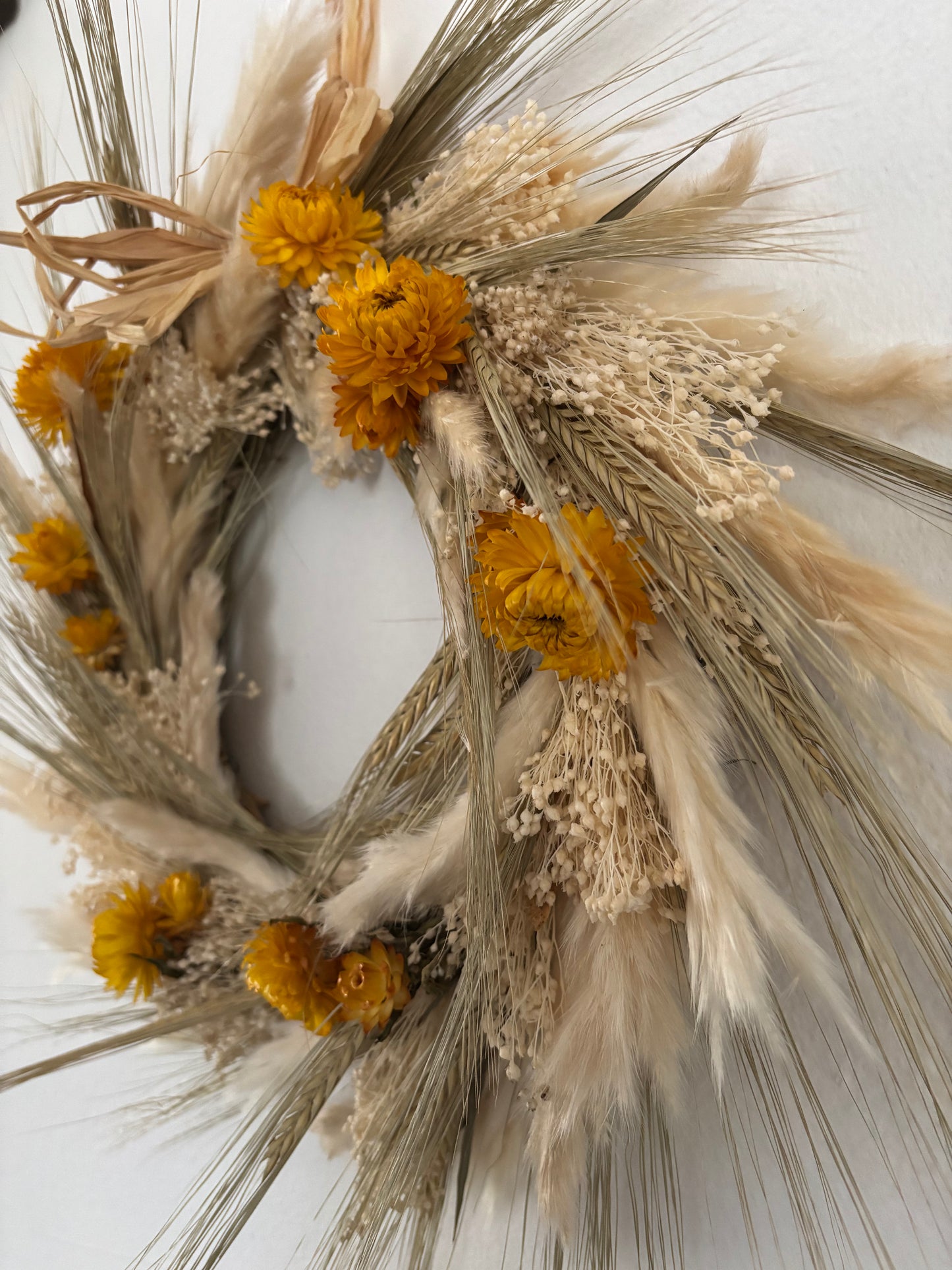 Yellow and ivory dried flower wreath side view