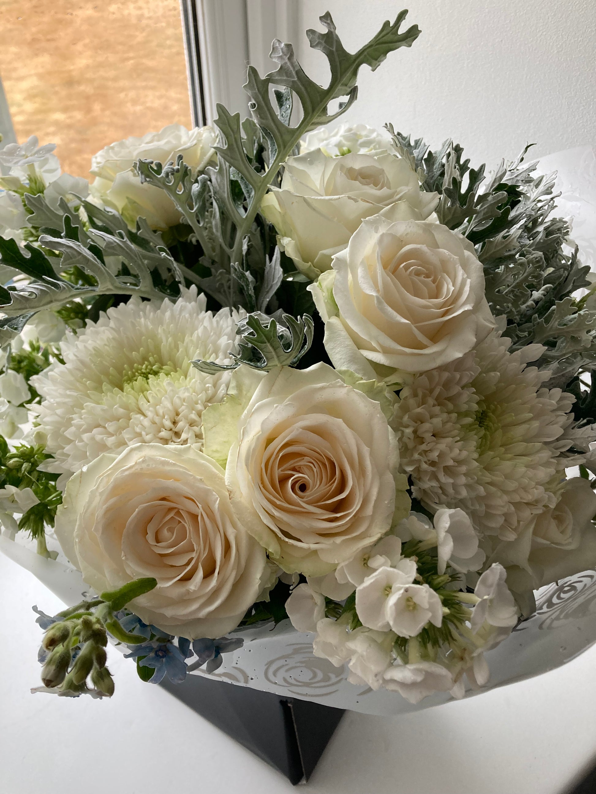 The Cathedral.  A Hand Tied Bouquet of fresh flowers in Neutral shades