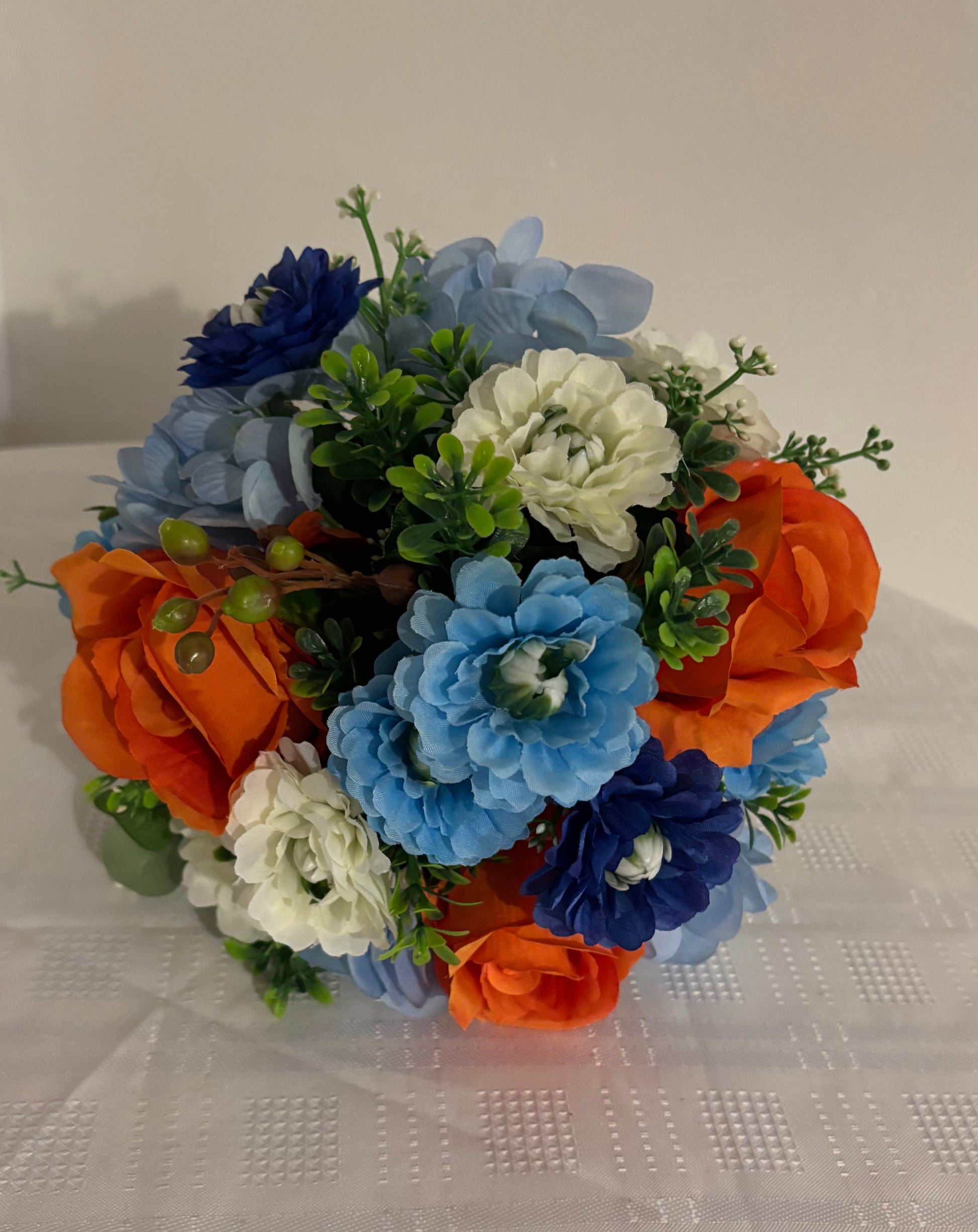 Brides posy bouquet blue and orange