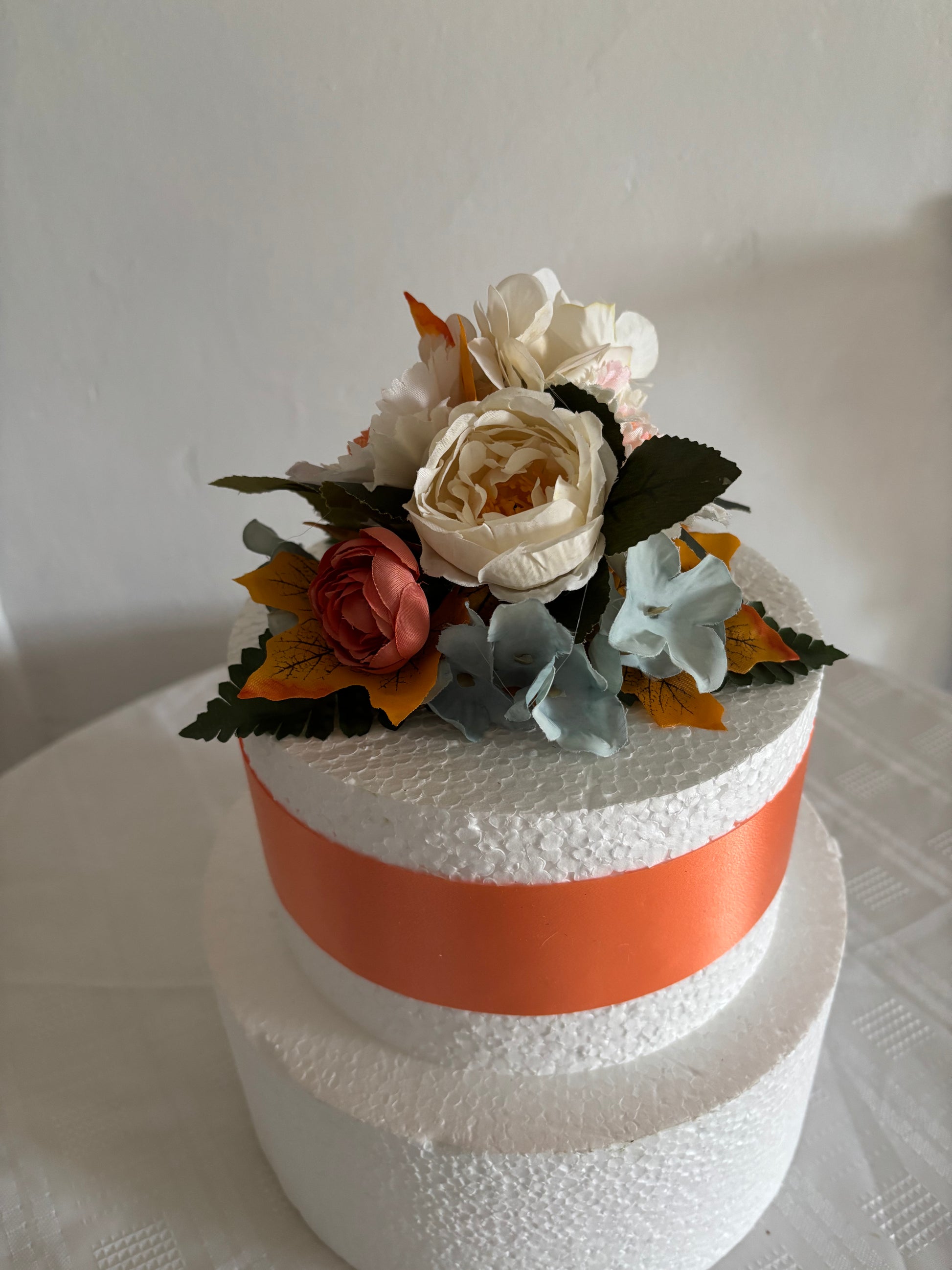 Pretty orange and blue caker topper