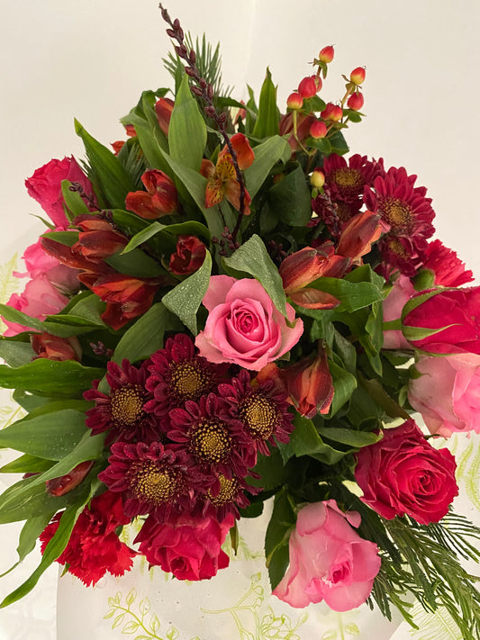 Christmas Wishes. Hand Tied Bouquet of mixed fresh flowers inspired by festive vibes.