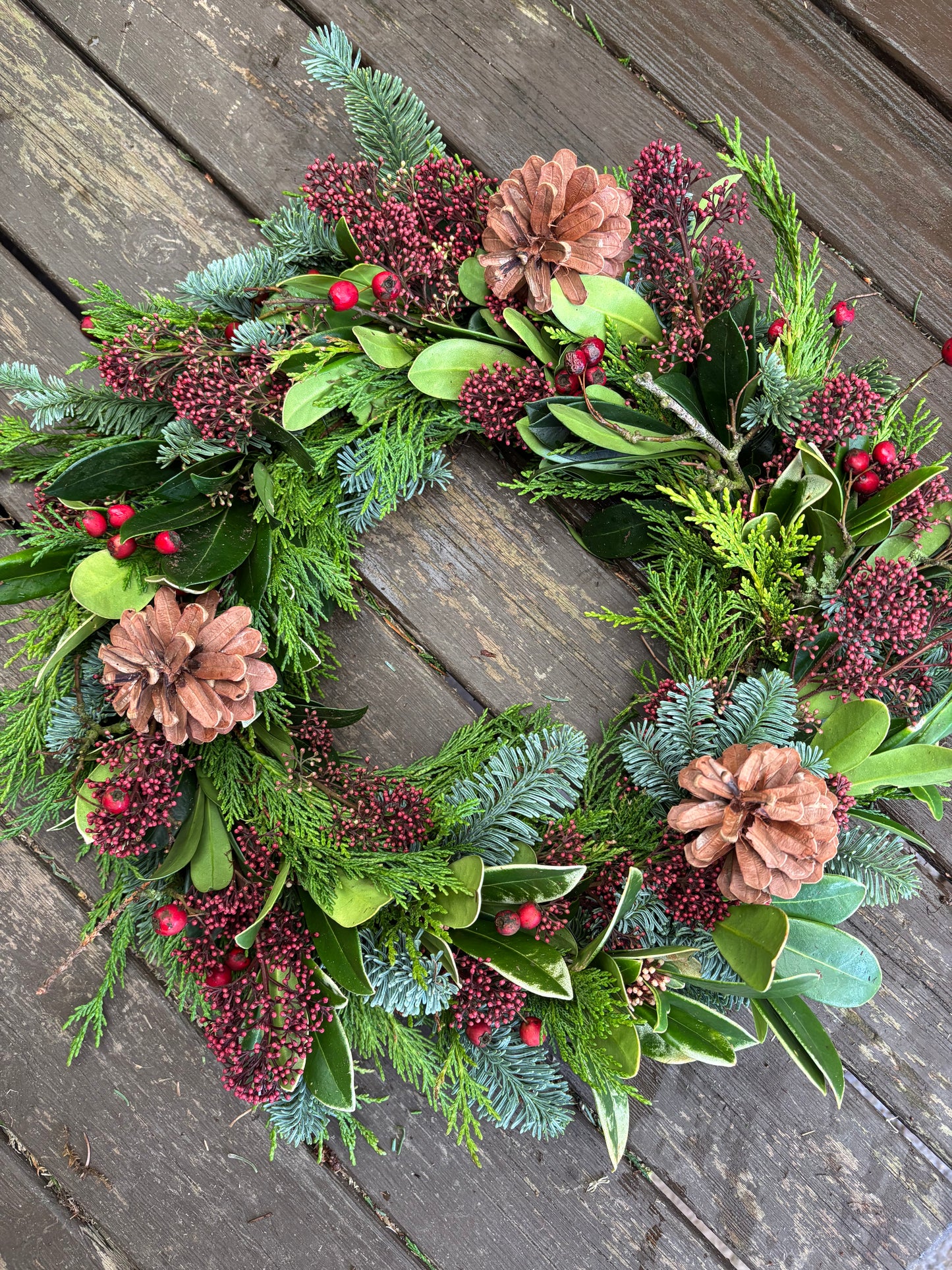 Biodegradable Round Wreath of open mixed greenery and flowers ideal for a natural burial