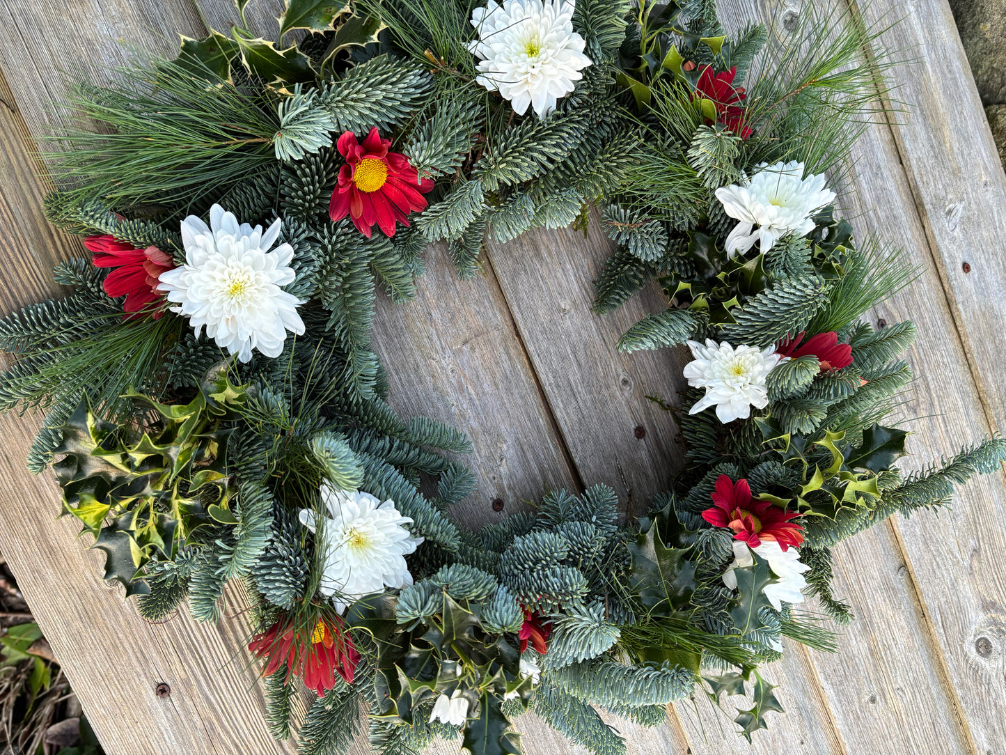 Biodegradable Round Wreath of open mixed greenery and flowers ideal for a natural burial
