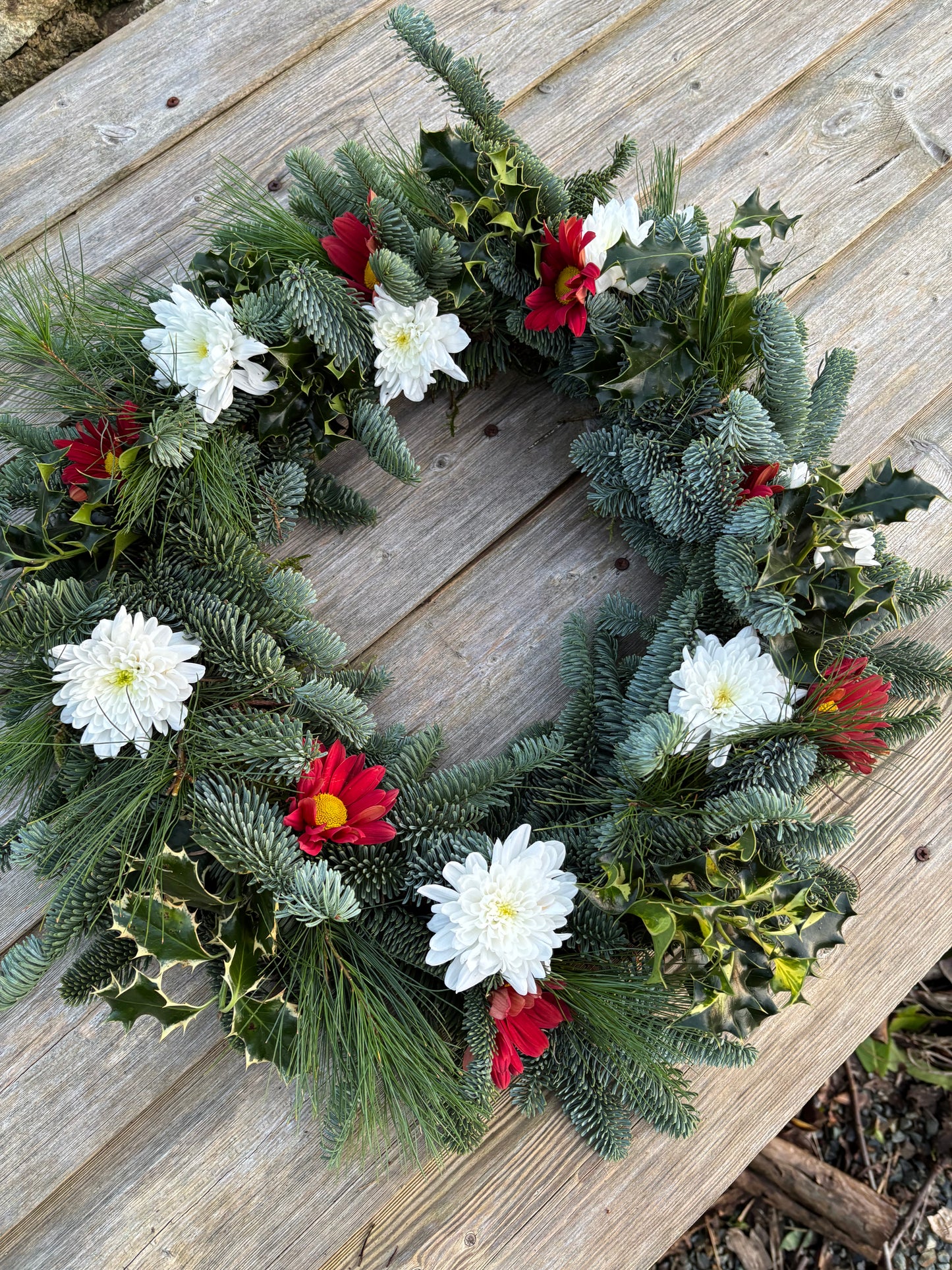 Biodegradable Round Wreath of open mixed greenery and flowers ideal for a natural burial