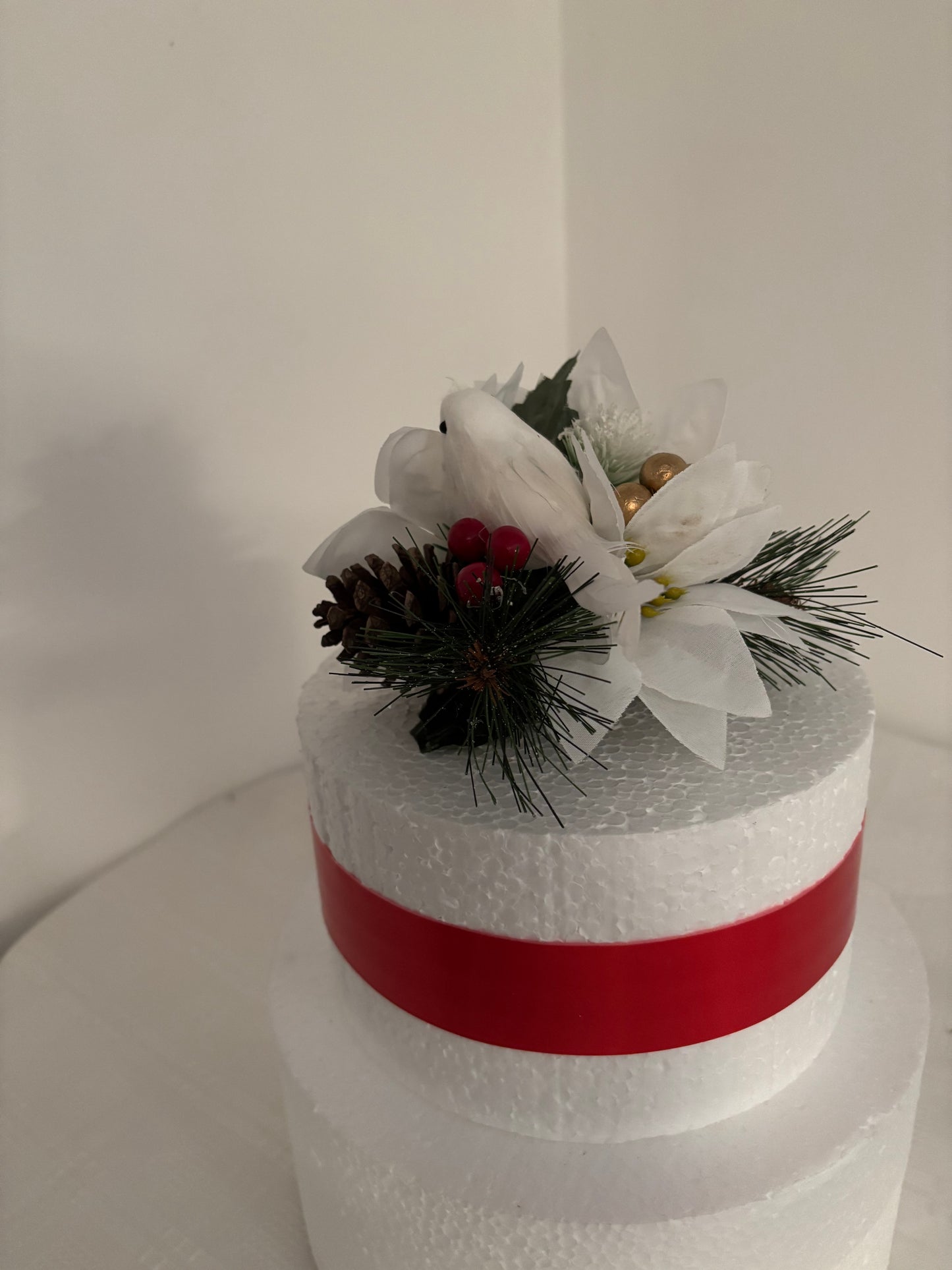 White dove and White Silk Poinsettia Pine cone and berry Christmas Cake Topper