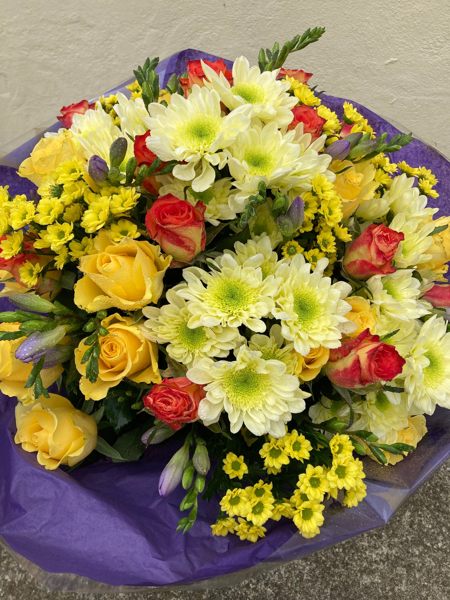 View on the Coast Path.  Hand Tied Bouquet of mixed fresh flowers in shades of yellow.