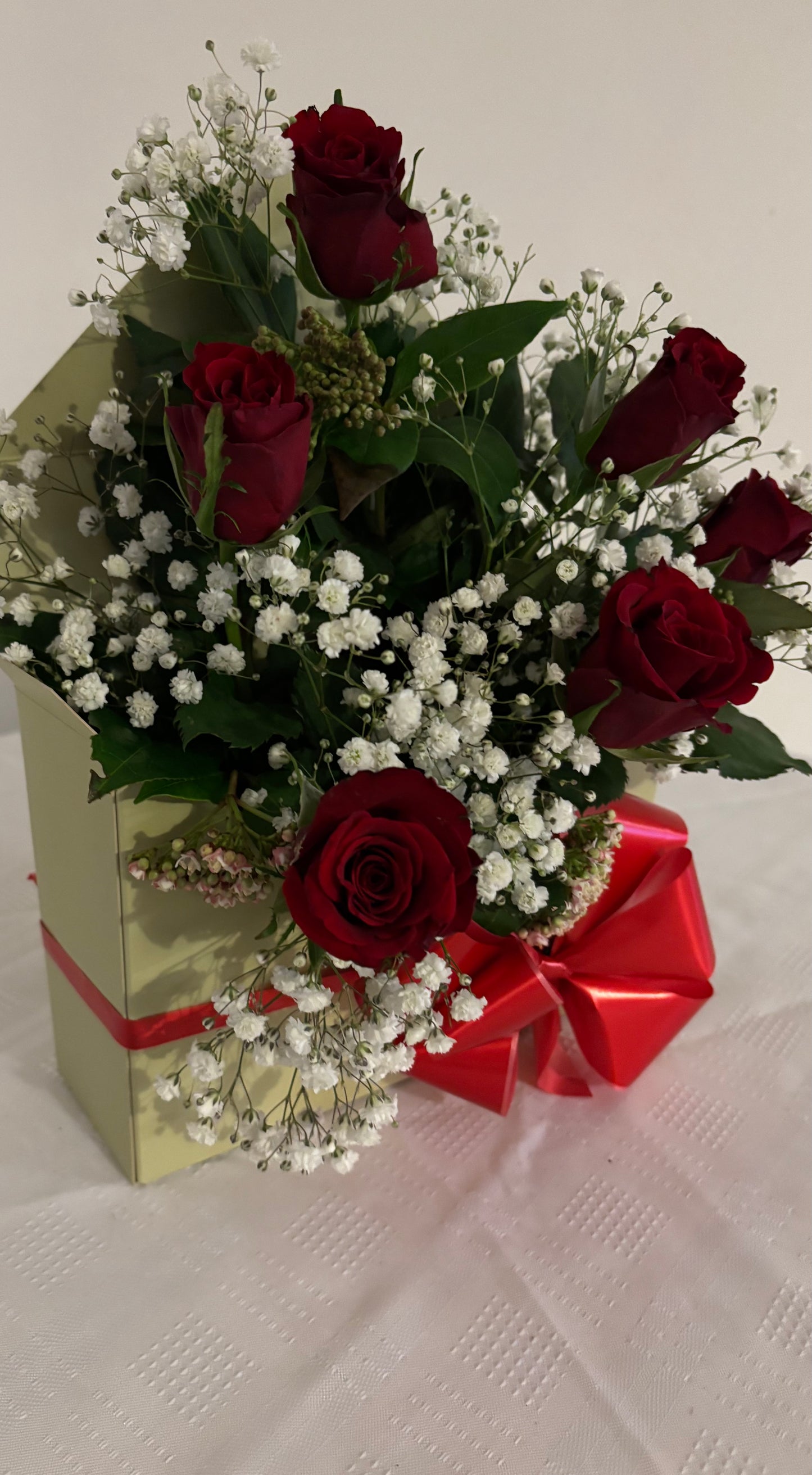 Enveloped in Romance. Fresh roses arranged in an envelope card.