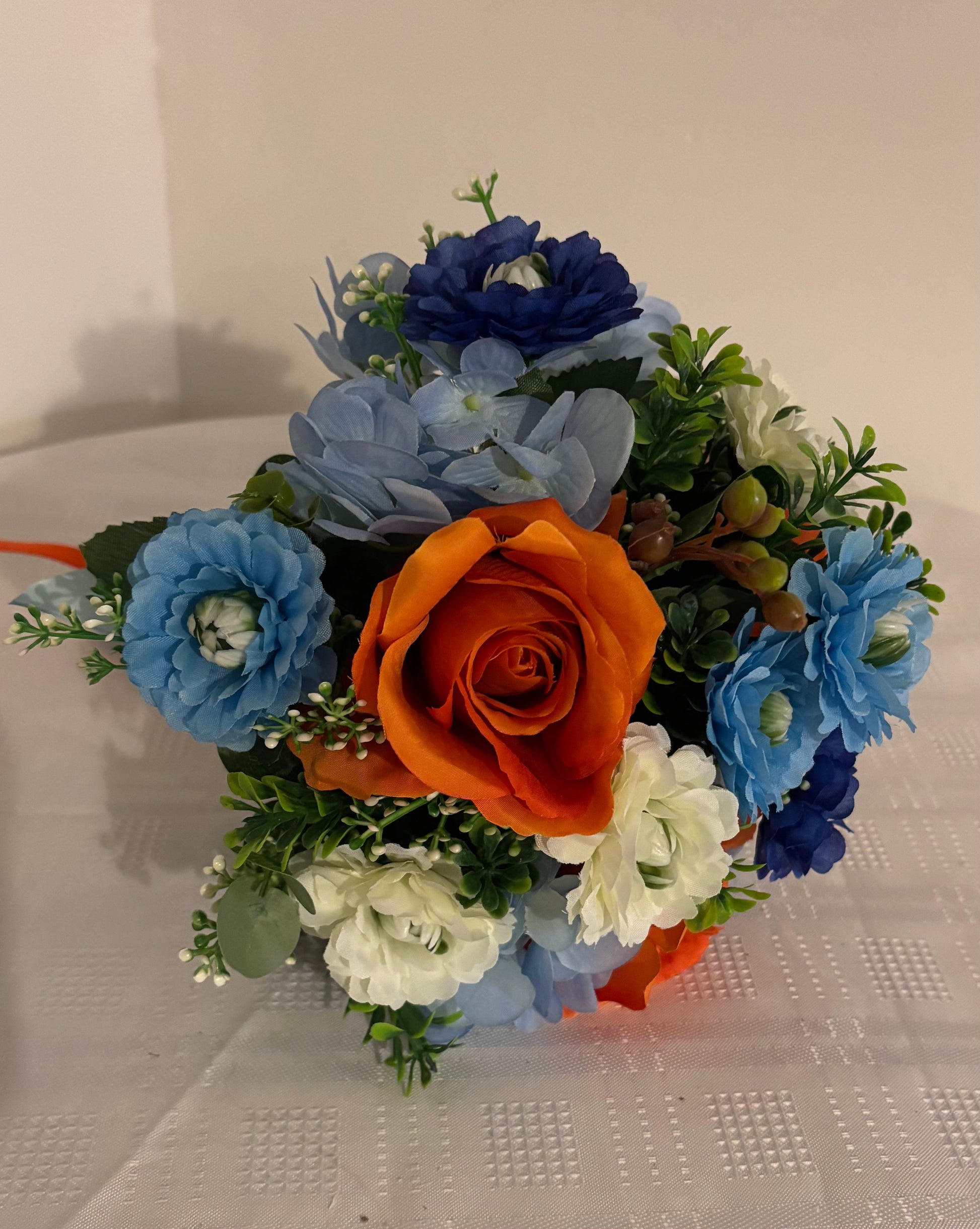 Blue aster orange rose posy